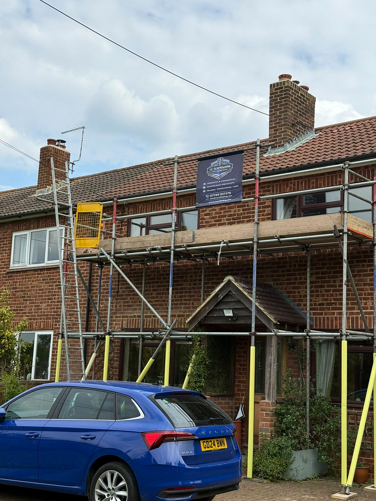 Roof-level access on a Kent home with the I.C. Scaffolding banner up